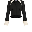 Black Stolen Stores Kaia shirt, a stylish women’s top with a relaxed fit and minimalist design, shown in black and white.