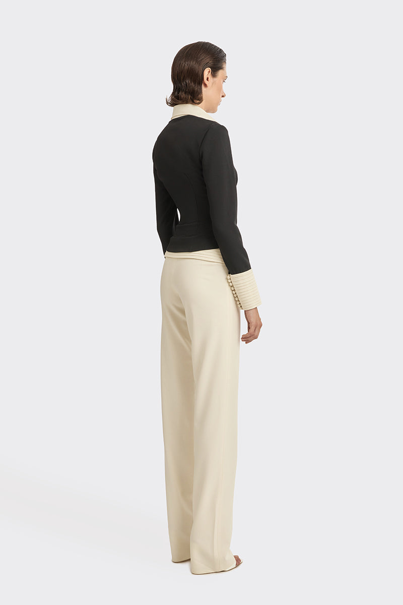Black KAIA shirt from Stolen Stores, a stylish tops product with a simple design, shown in the image.