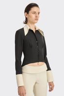 Black Kaia shirt by Stolen Stores, a stylish tops option featuring a sleek design and contrasting white accents.