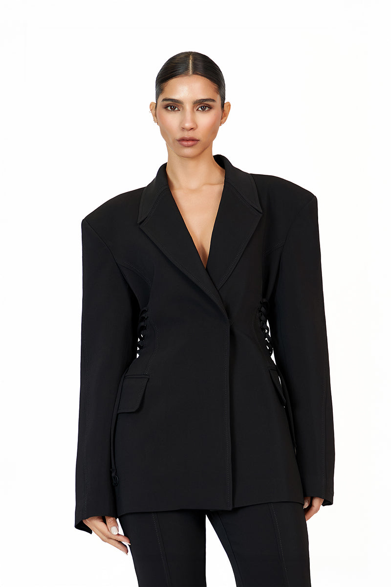 Black KALLISTE blazer by Khanum's, tailored fit, with lapels and button closure, shown on a model.