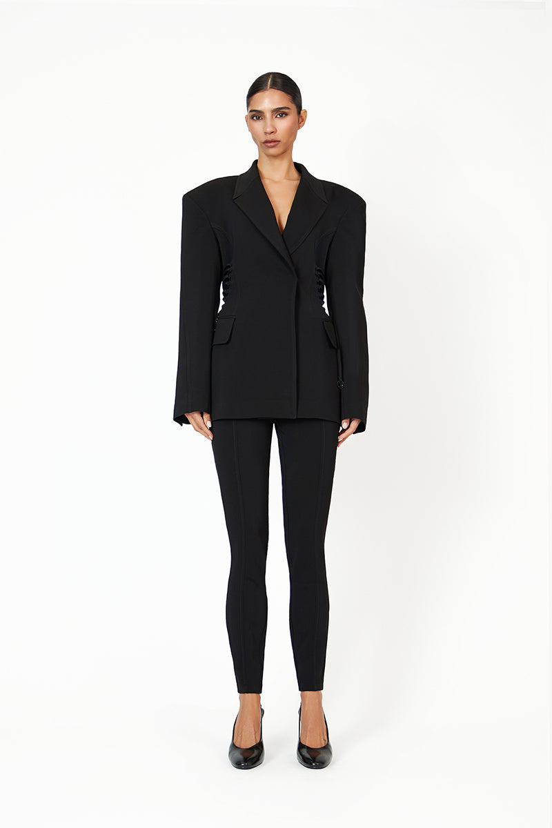 Black KALLISTE blazer by Khanum's, tailored fit with lapel collar, displayed on a hanger.