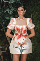 Nana Gotti Kalya mini dress in vibrant fabric, sleeveless design with a fitted silhouette and stylish short hemline.