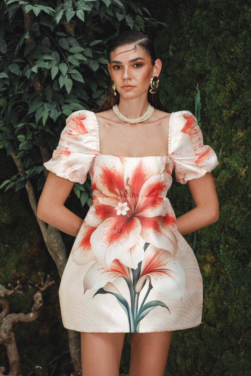 Nana Gotti Kalya mini dress in vibrant fabric, sleeveless design with a fitted silhouette and stylish short hemline.