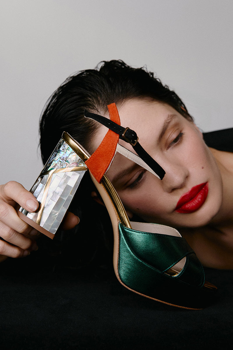 Elegant black leather heels by Freya Rose featuring sleek pointed toes and stylish ankle straps.