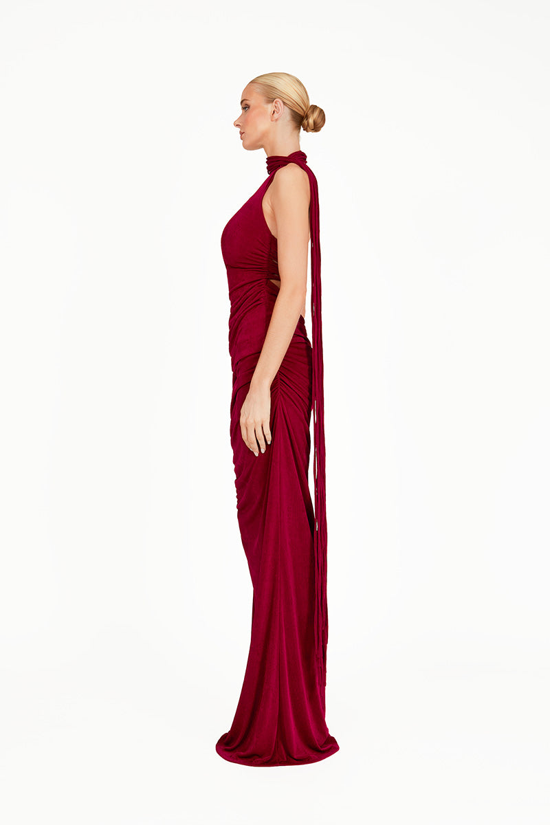 Red Karmine co-ord set featuring a maxi dress from Khanum's, displayed on a hanger with a fitted bodice and flowing skirt.