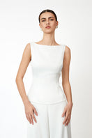 White KASTRID top by Khanum's, featuring a stylish design, displayed on a mannequin for a trendy women's tops look.