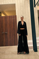 Black Kayla co-ord set by Khanum's featuring a matching top and bottoms, styled for a modern, coordinated look.