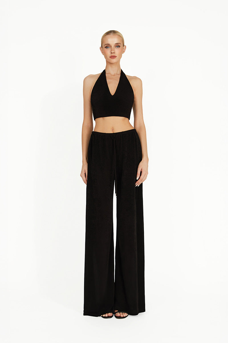 Black Kayla co-ord set by Khanum's featuring a fitted top and matching bottoms, styled for a chic, coordinated look.