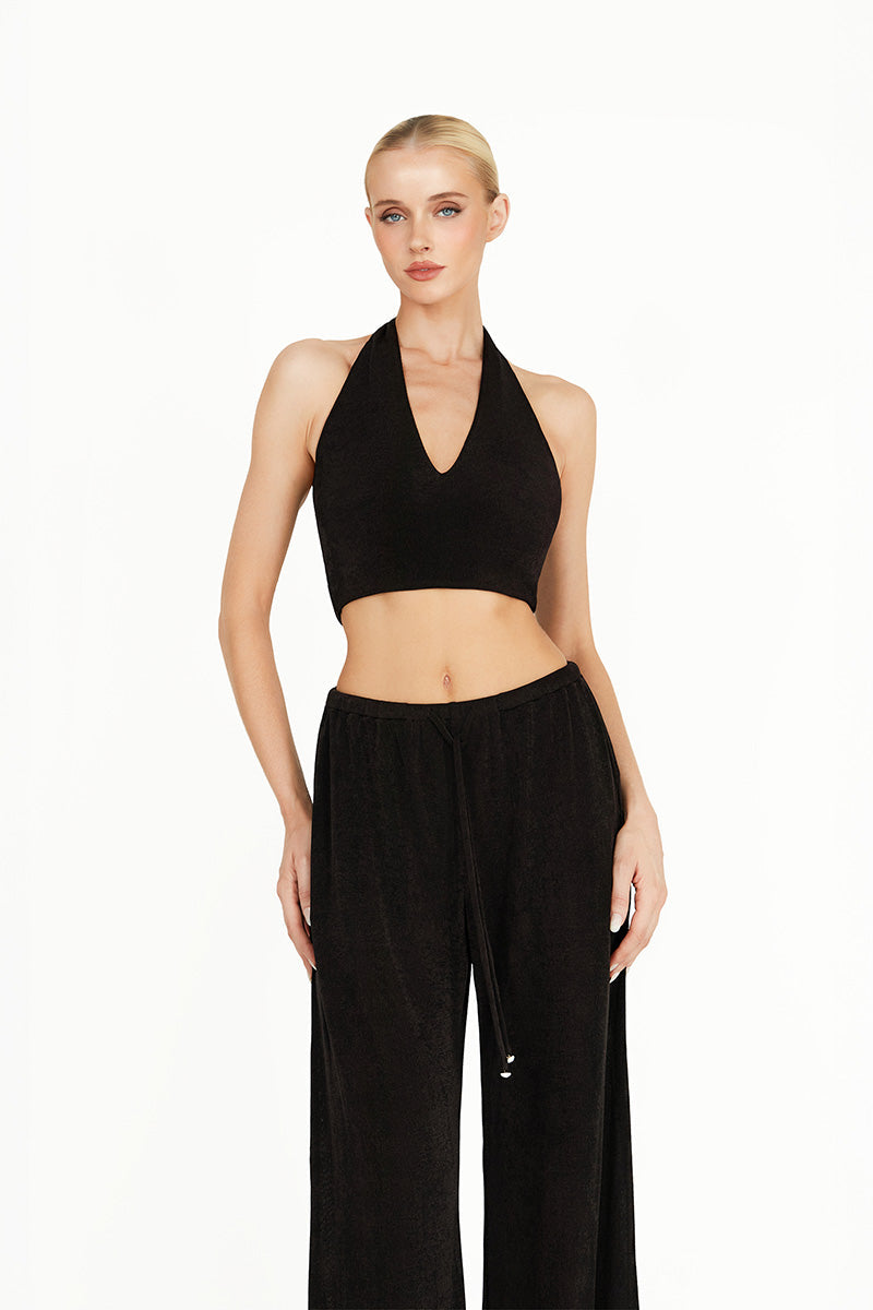 Black Kayla co-ord set by Khanum's featuring a fitted top and matching pants, styled for a modern, chic look.