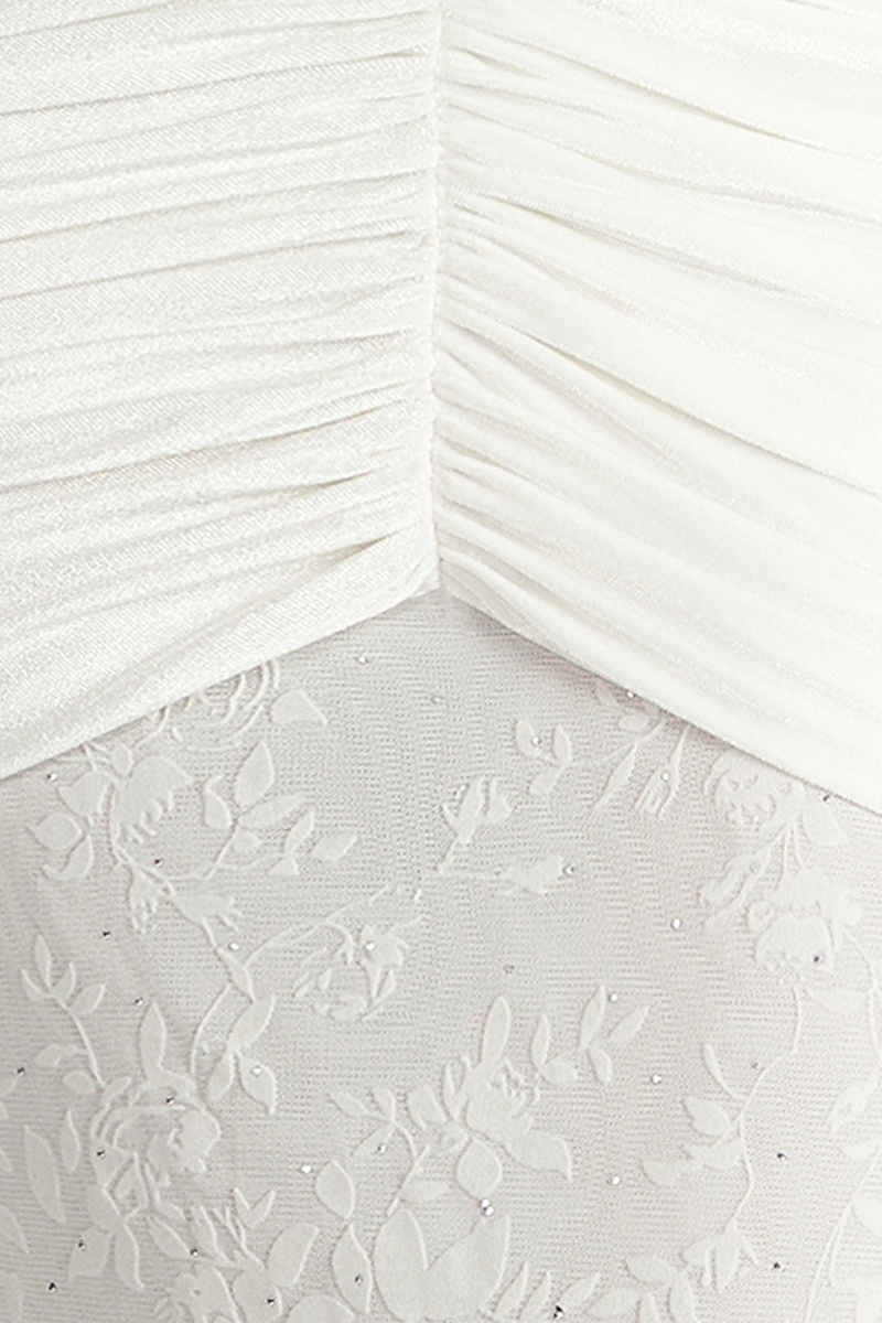 Close-up of Khanum's KAYLIN white maxi dress showcasing lightweight fabric and elegant design details.