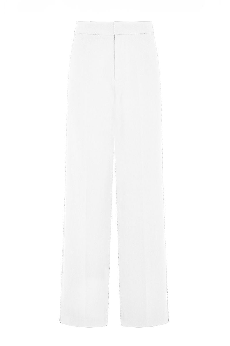 White Keep Pants by Khanum's featuring a relaxed fit and stylish design, shown on a model in a casual indoor setting.