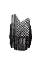 Black keffiyeh slip clutch bag with fringes by Sarah's Bag, featuring a textured pattern and compact design for stylish carry.