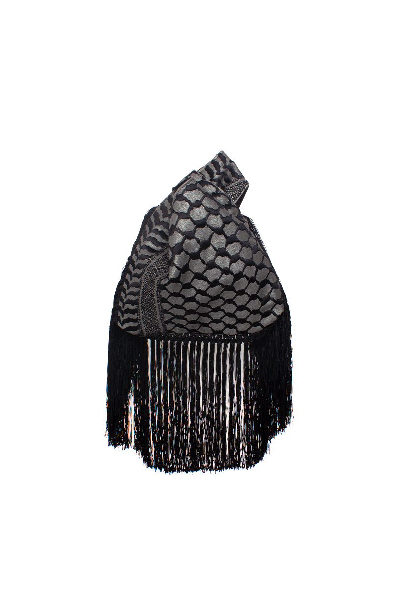 Black keffiyeh slip clutch bag with fringes from Sarah's Bag, stylish and compact accessory for everyday or evening use.