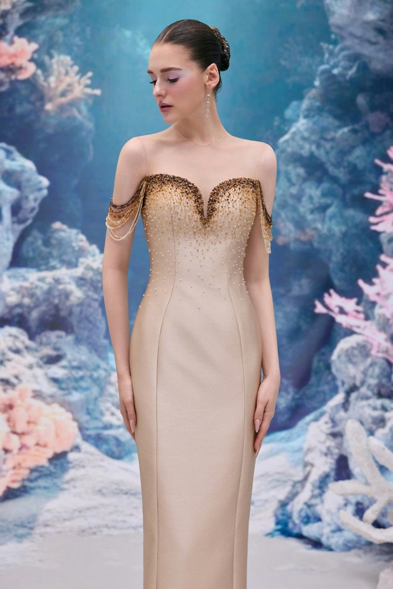 Beige Celeste royal taffeta gown by 21Six displayed on a mannequin, featuring elegant draping and luxurious fabric.