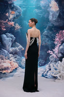 Black Noelle crepe gown by 21Six featuring elegant fabric and a fitted silhouette, showcased on a model.