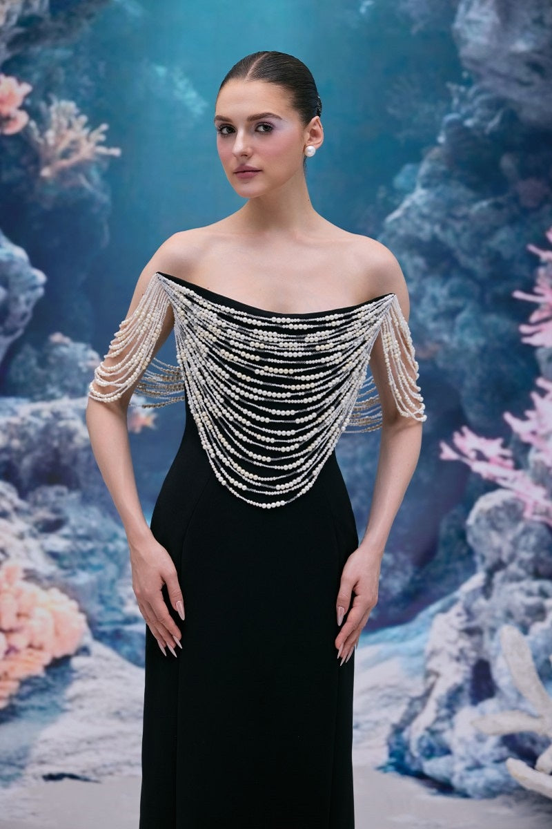 Black Noelle crepe gown by 21Six, featuring elegant design and flowing fabric, perfect for formal occasions.