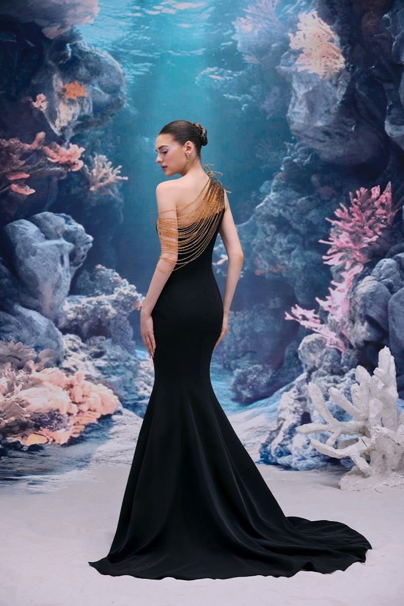 Black Thalia crepe gown by 21Six, showcasing elegant, flowing fabric with a fitted waist and stylish neckline.