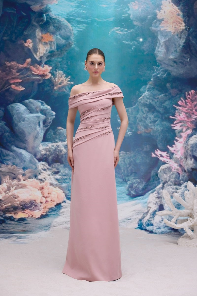 Light rose NADINE crepe gown by 21Six, featuring a flowing silhouette and elegant design, showcased in a detailed fashion image.