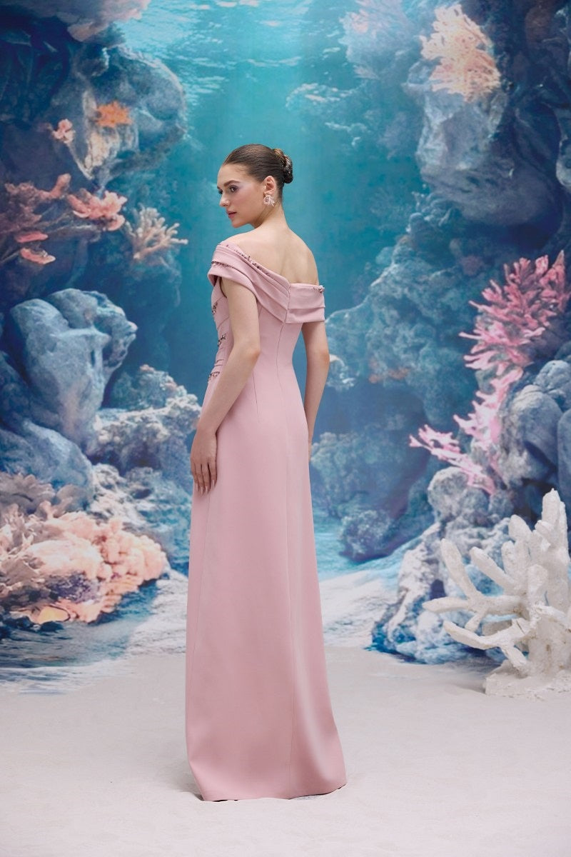 Light rose Nadine crepe gown by 21Six, featuring elegant fabric and a flowing silhouette, displayed on a model.