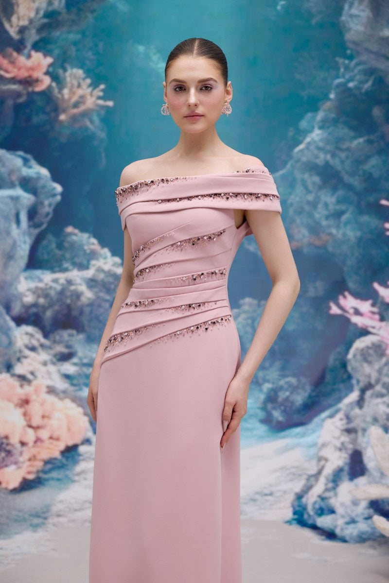 Light rose NADINE crepe gown by 21Six, featuring a flowing silhouette and elegant design, displayed on a model.