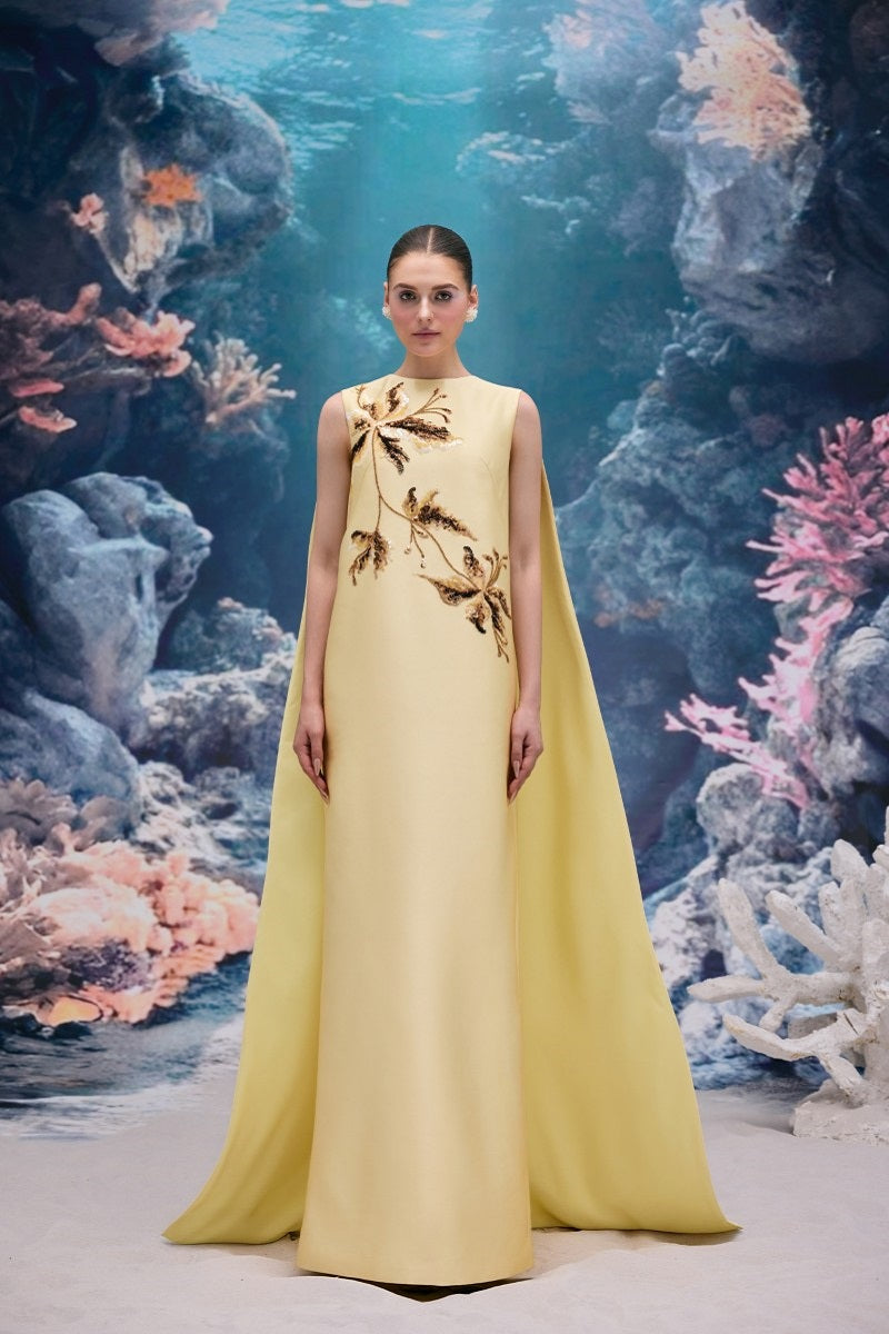 Elegant pale yellow taffeta gown by 21Six, featuring a flowing design and intricate details, perfect for formal occasions.
