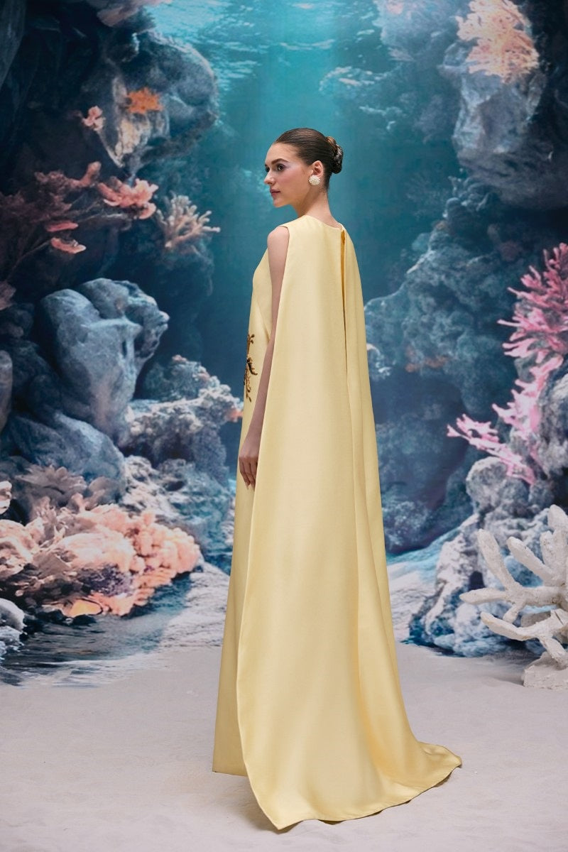 Elegant pale yellow taffeta gown by 21Six, the Lysandra Royal Taffeta Dress, featuring a flowing, luxurious design for formal occasions.