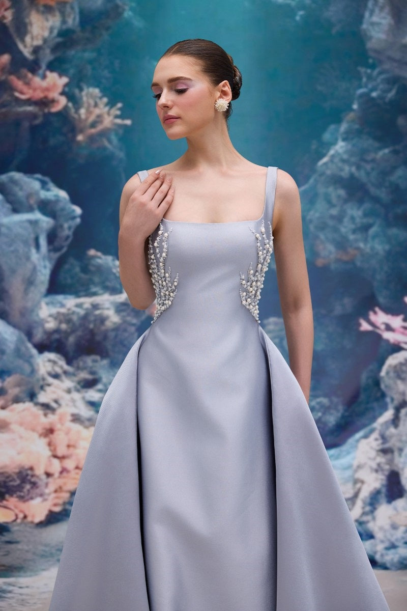 Elegant blue Carolina taffeta gown by 21Six, featuring a flowing silhouette and intricate detailing, perfect for formal occasions.
