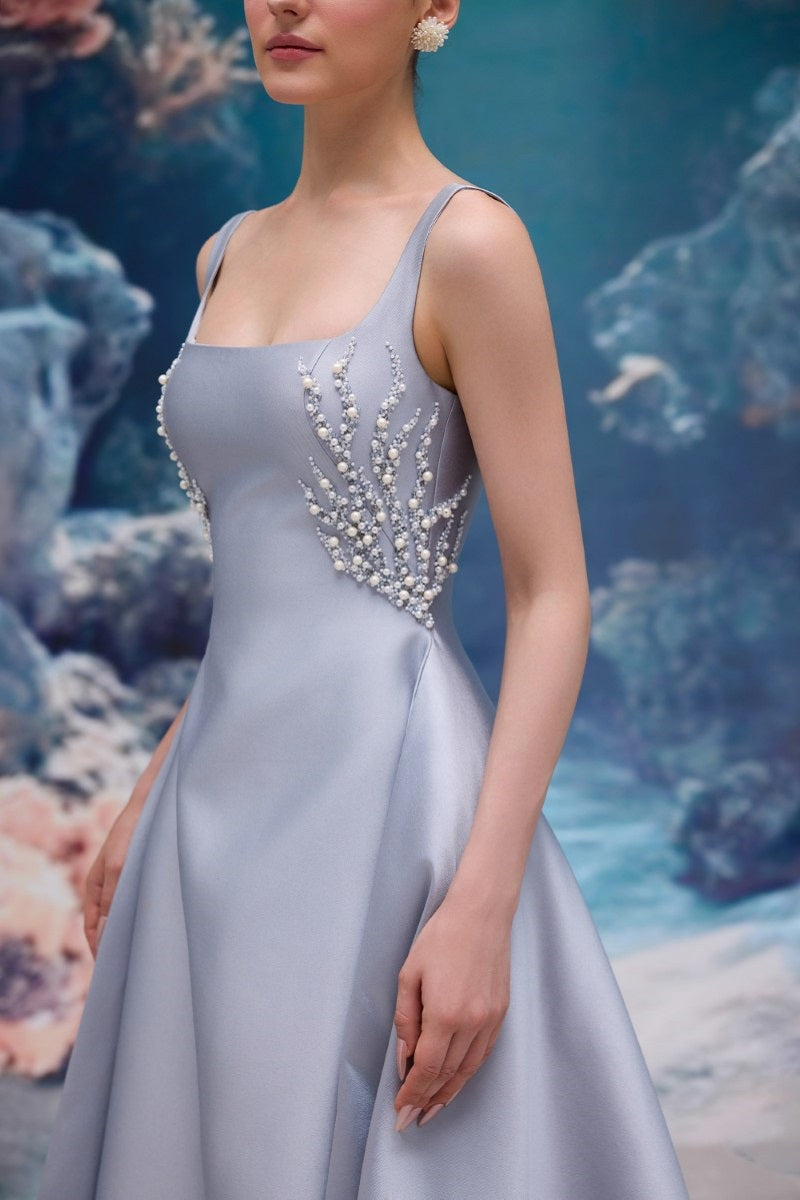 Elegant blue Sienna Royal Taffeta gown by 21Six, featuring a flowing design and intricate details, displayed on a mannequin.