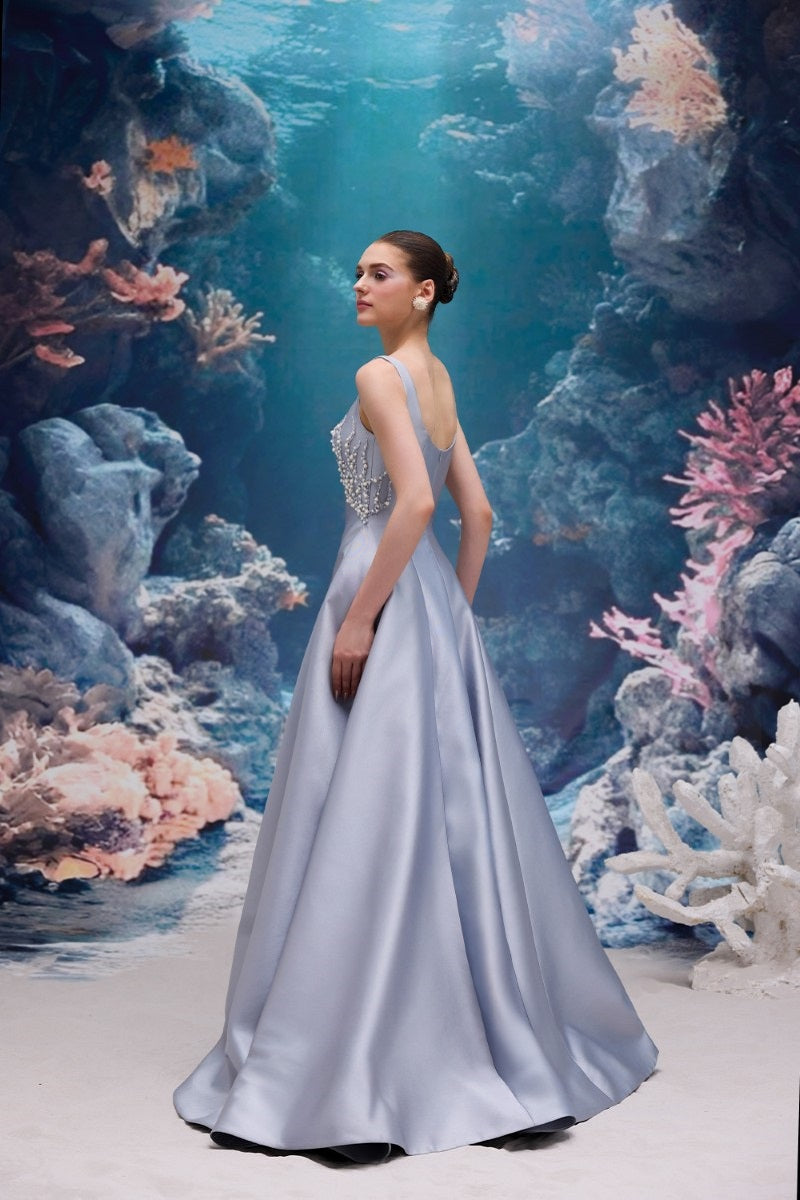 Elegant blue Sienna Royal Taffeta gown by 21Six, featuring a flowing design and detailed fabric texture.