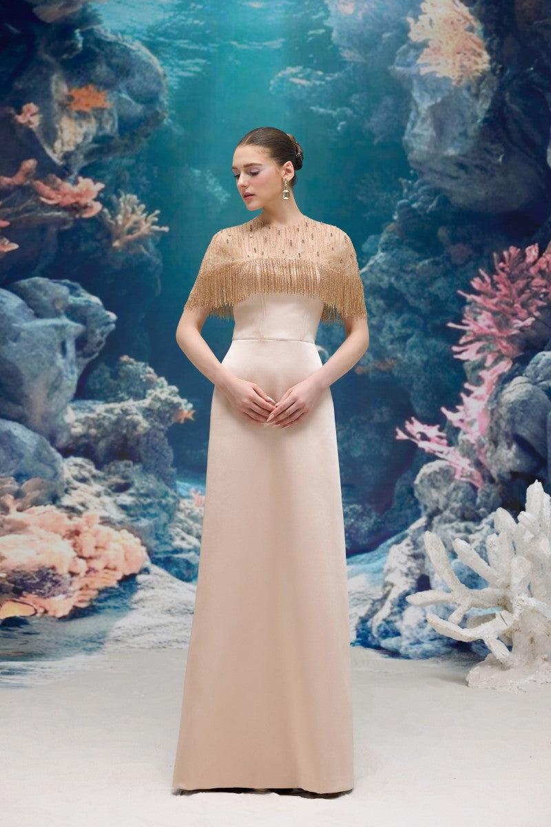 Beige Marcelline silk taffeta and tulle gown by 21Six, featuring elegant flowing fabric and intricate design details.