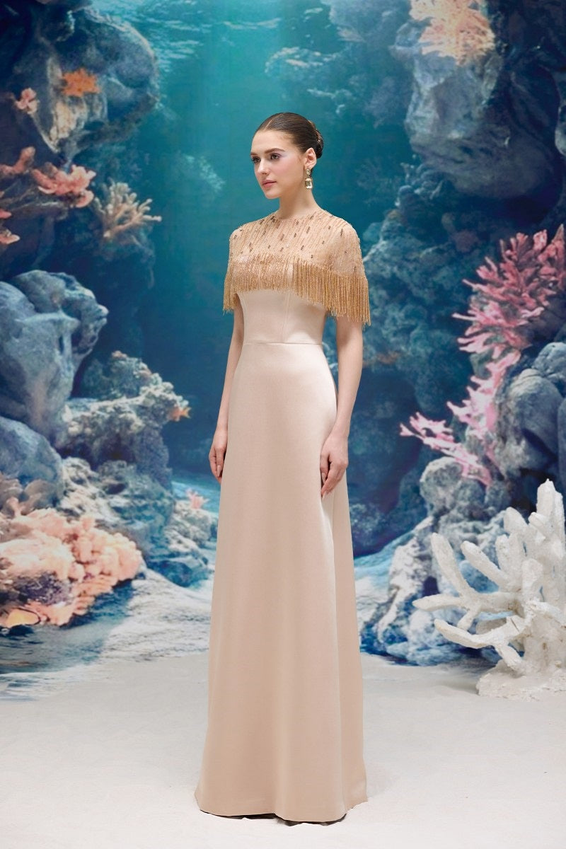 Beige Marcelline silk taffeta and tulle gown by 21Six, featuring elegant flowing fabric and intricate design details.