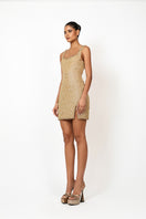 Kerri mini dress in gold by Khanum's, featuring a stylish fit and shimmering fabric, shown on a mannequin.