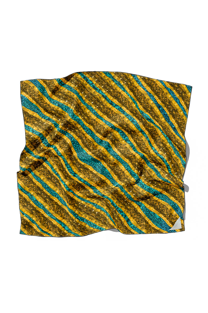 Amel Batita Khamon Brocot silk scarf featuring intricate geometric patterns, draped to showcase its vibrant design and luxurious fabric.