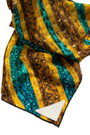 Elegant silk Khamon Brocot scarf by Amel Batita featuring intricate patterns and vibrant colors, displayed close-up detail.