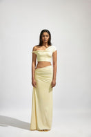 Deme By Gabriella KIRA butter yellow co-ord set featuring a fitted top and matching skirt, stylish and perfect for casual wear
