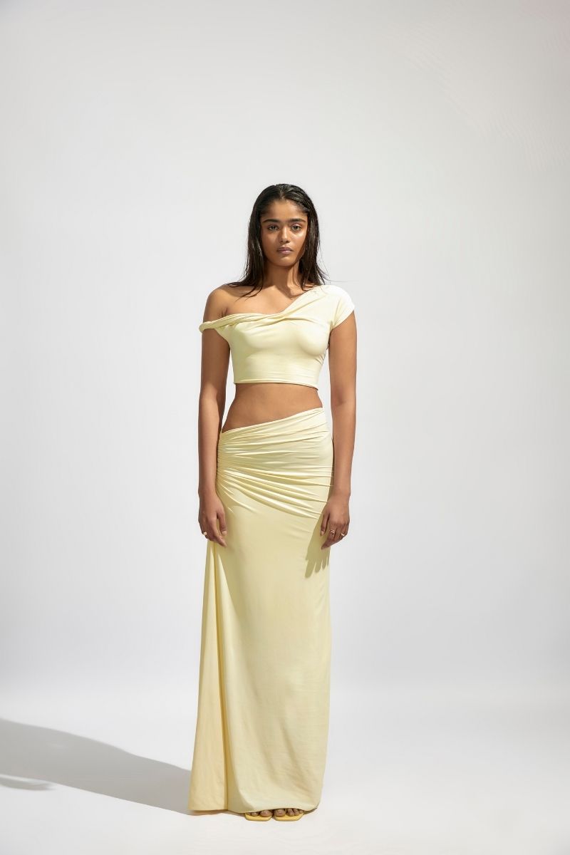Deme By Gabriella KIRA butter yellow co-ord set featuring a fitted top and matching skirt, stylish and perfect for casual wear