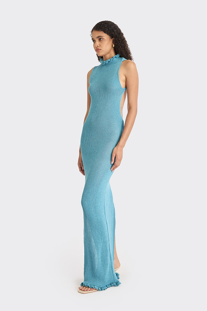 Blue knit low-back maxi dress by Stolen Stores, featuring a flowing silhouette and elegant design.