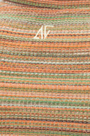 Striped knit crop top from Bassigue, featuring a fitted design and long sleeves, perfect for casual and stylish looks.