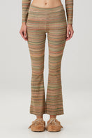Striped knit flare sweatpants by Bassigue, featuring a comfortable fit and stylish design, shown in a close-up image.