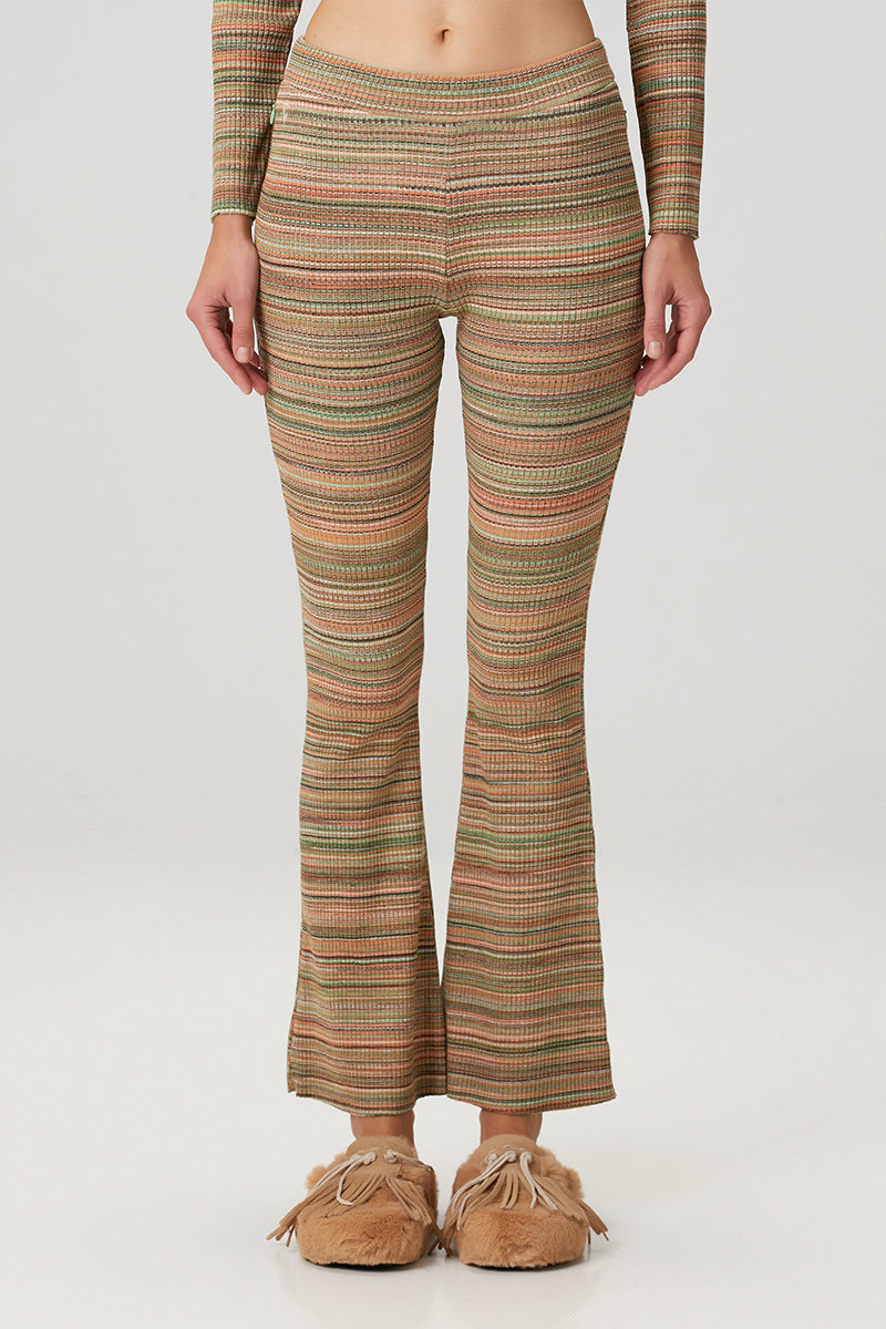 Striped knit flare sweatpants by Bassigue, featuring a comfortable fit and stylish design, shown in a close-up image.