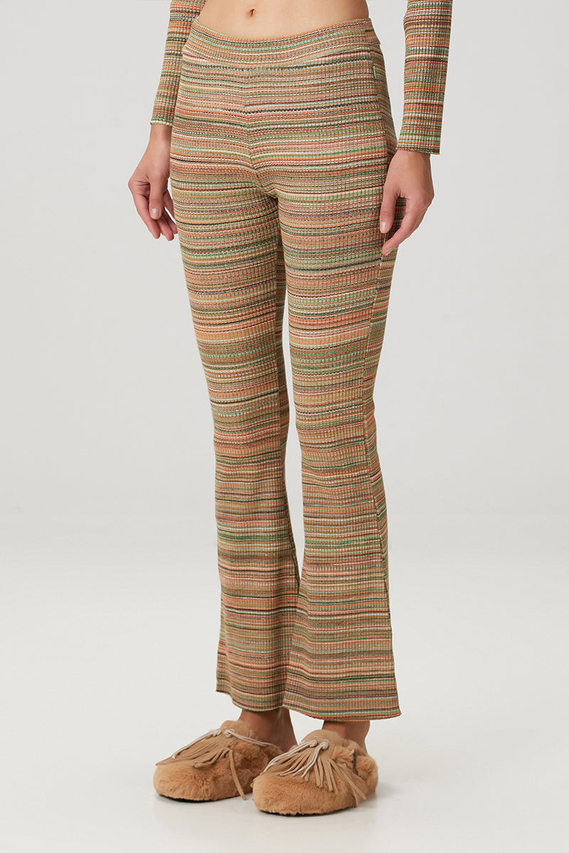 Striped knit flare sweatpants by Bassigue, showing the comfortable, stylish design with ribbed cuffs and a relaxed fit.