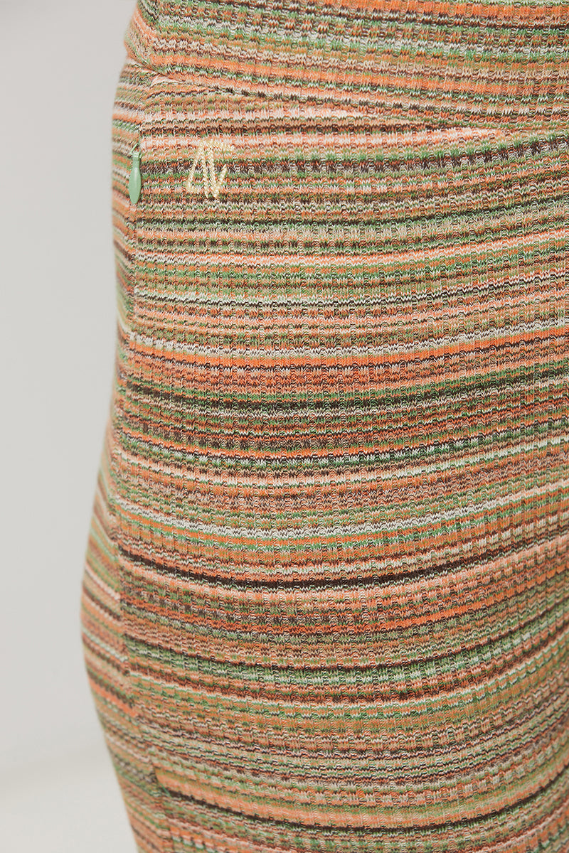 Striped knit flare sweatpants by Bassigue featuring a comfortable fit and stylish design, shown in a close-up view.