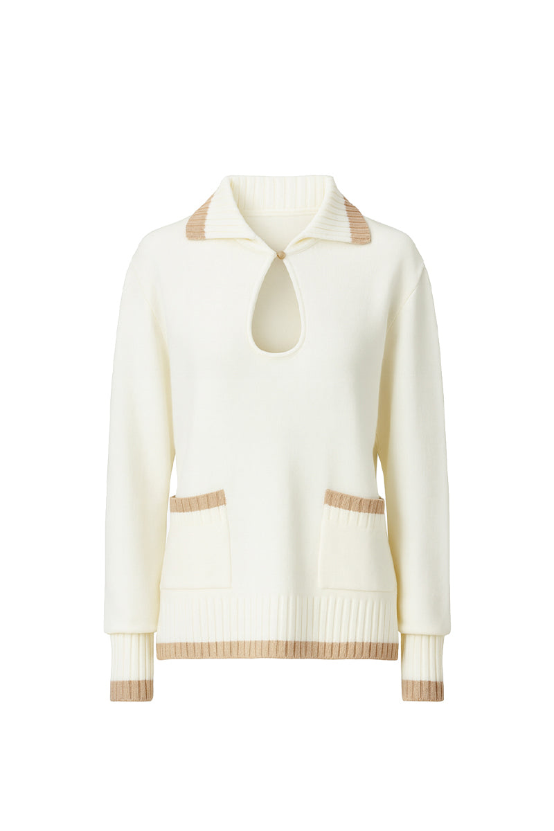 White knit sweater with pocket detailing from Bassigue, featuring a cozy, textured design and a stylish, relaxed fit.