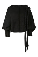 Black knitted sweater with long braids from MAZ Manuela Álvarez, featuring a cozy, textured design and long sleeve style.
