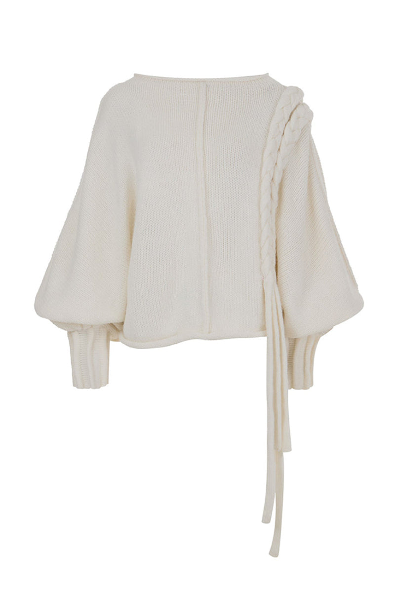 Ivory knitted sweater with long braided details from MAZ Manuela Álvarez, cozy and stylish for casual wear.