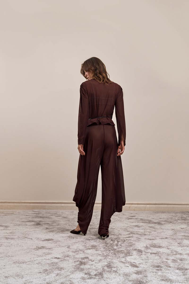 Back view of YASSMIN SALEH brown knot pants showing stylish front knot detail and relaxed fit.