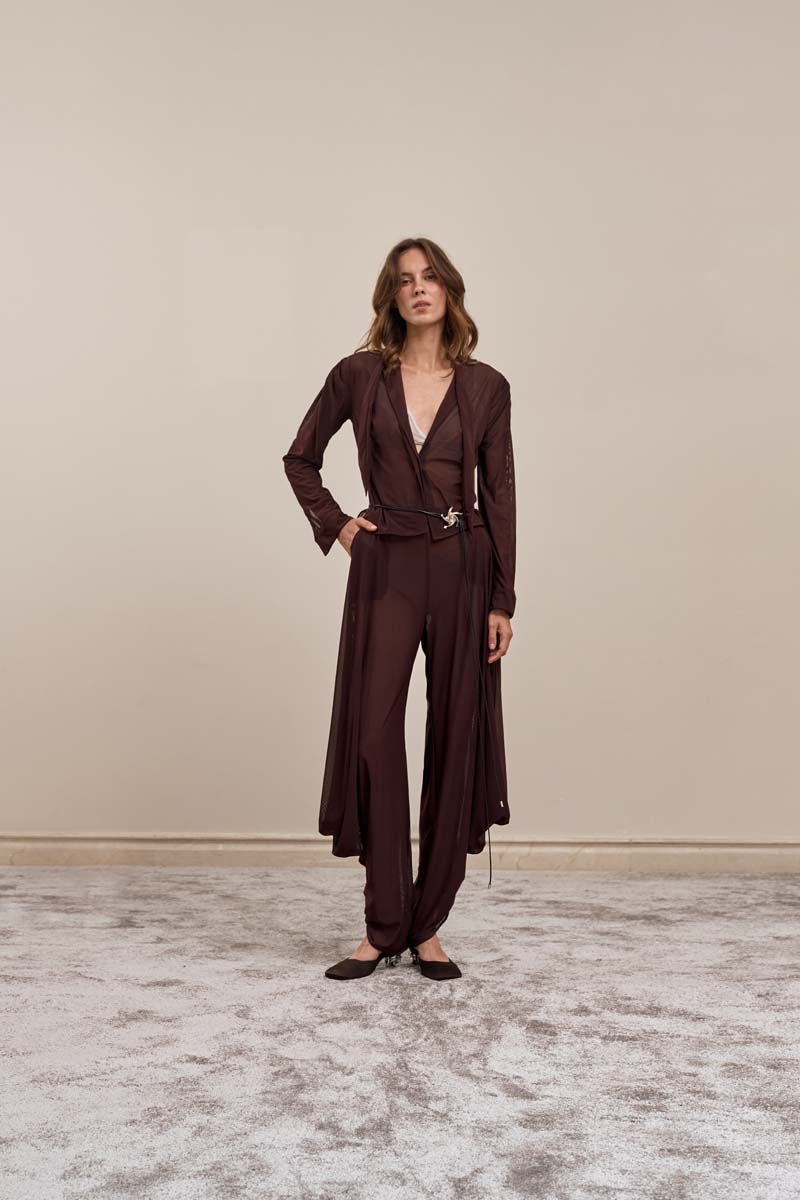 Brown YASSMIN SALEH knot pants featuring a front view with a stylish knot detail and relaxed fit.