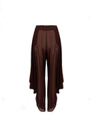 Brown YASSMIN SALEH knot pants with front knot detail, showcasing a stylish and comfortable design.