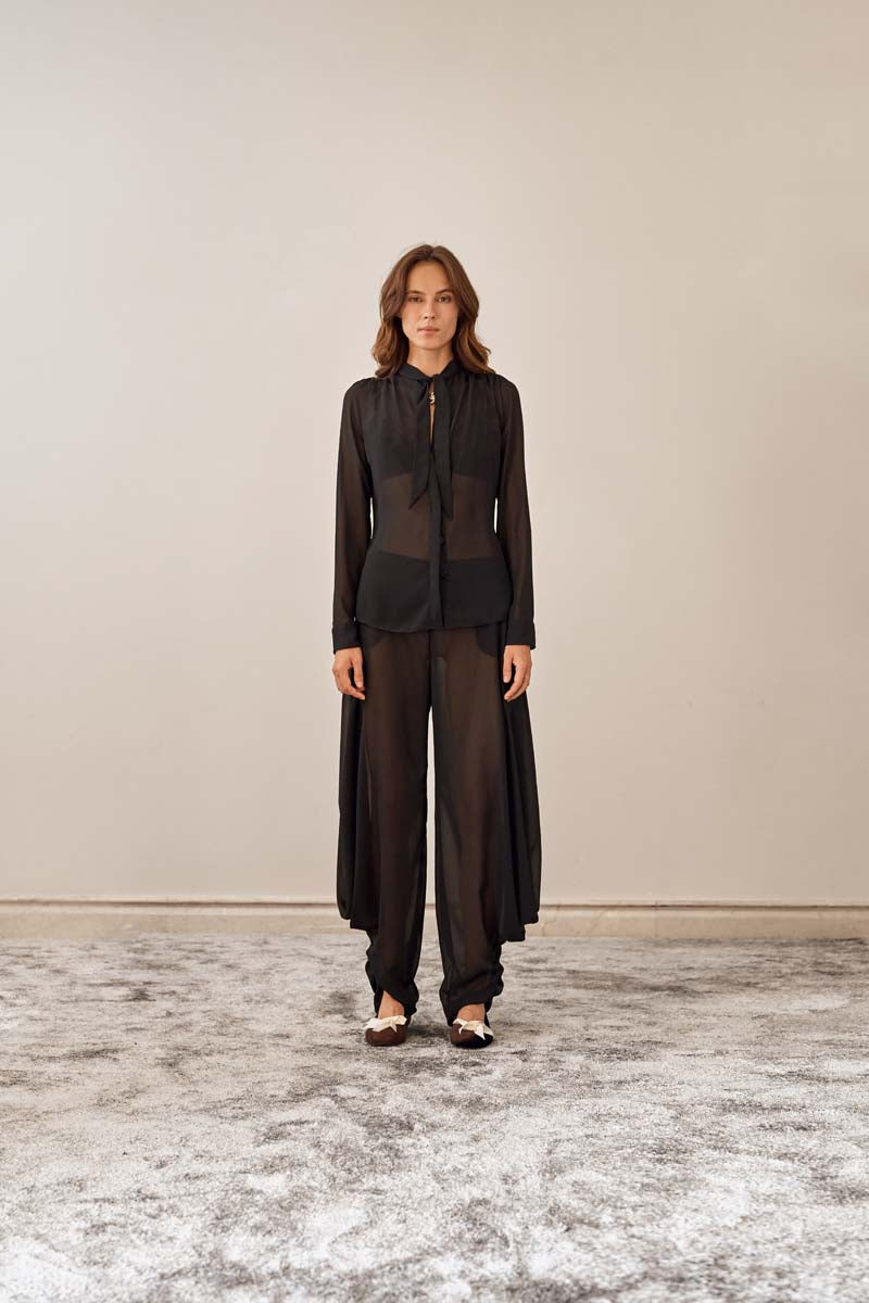 YASSMIN SALEH black knot pants with front knot detail, stylish and comfortable pants for casual or chic outfits.