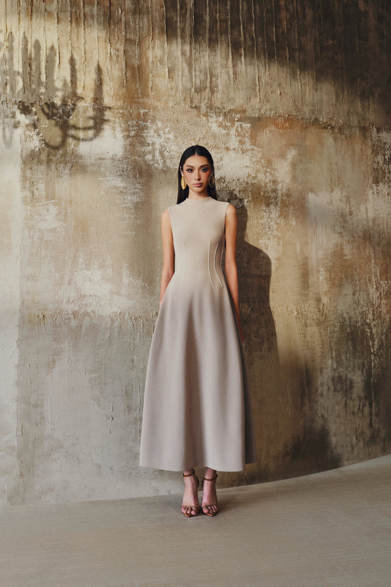 L'SCARLETT sleeveless flared midi dress with a fitted bodice and flowing skirt, stylish and perfect for summer occasions.
